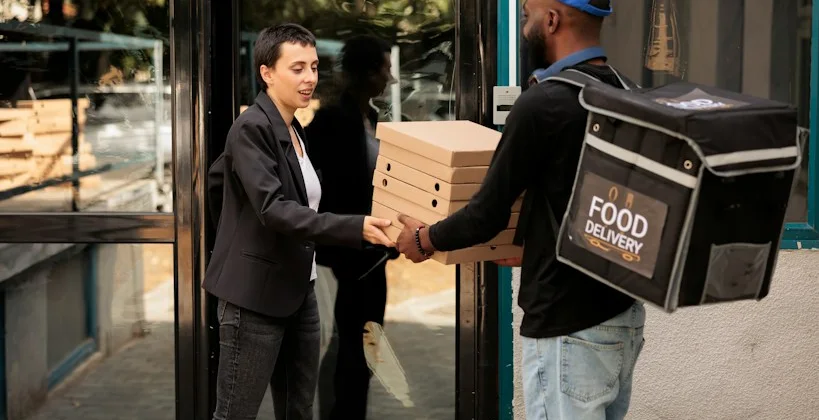 Rider handing over a food delivery